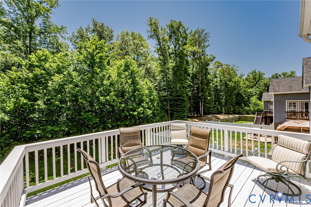 7435 Wicks Road Williamsburg, VA 23188 - Photo 38 of 82 Spacious outdoor deck with white railing, featurin