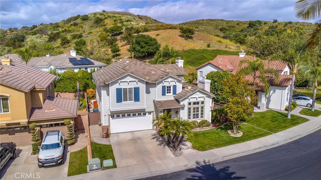 20 Spring View Way Rancho Santa Margarita, CA 92688 - Photo 1 of 1 an aerial view of multiple houses with a yard