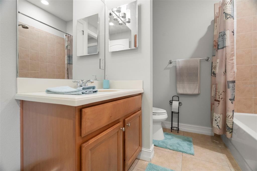 1342 Ribolla Drive Palm Harbor, FL 34683 - Photo 14 of 37 a bathroom with a sink toilet and shower