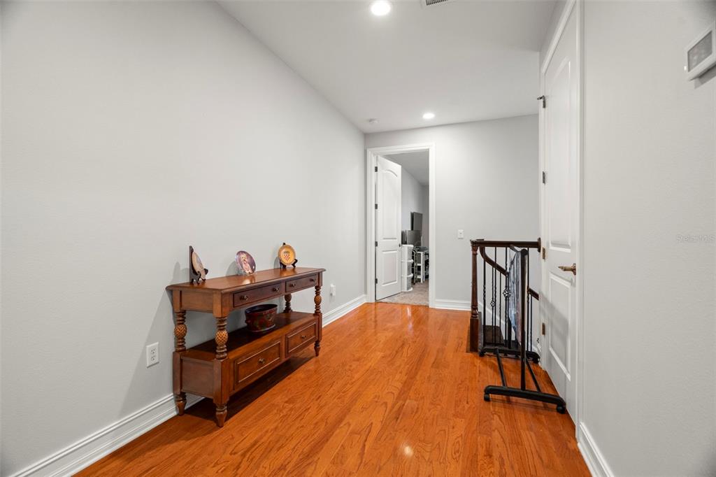 1342 Ribolla Drive Palm Harbor, FL 34683 - Photo 17 of 37 a living room with furniture and a wooden floor