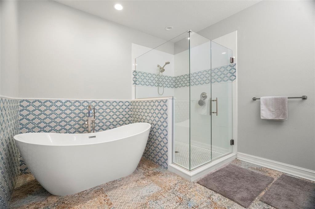 1342 Ribolla Drive Palm Harbor, FL 34683 - Photo 21 of 37 a white tub sitting next to a shower