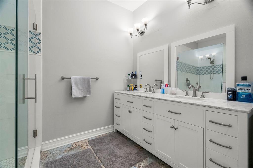 1342 Ribolla Drive Palm Harbor, FL 34683 - Photo 23 of 37 a bathroom with a sink vanity and mirror