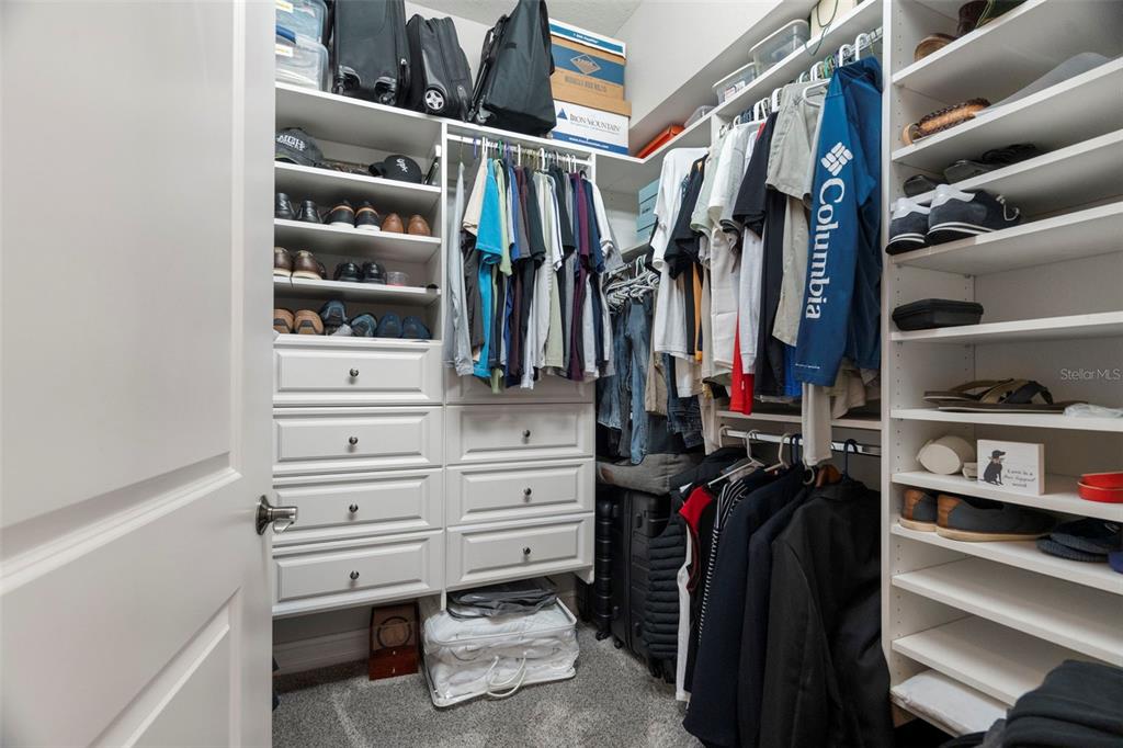 1342 Ribolla Drive Palm Harbor, FL 34683 - Photo 24 of 37 a view of walk in closet with clothes and shoes