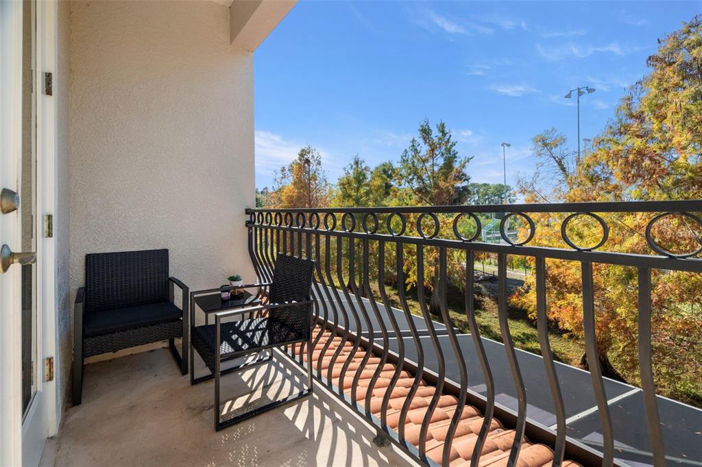 1342 Ribolla Drive Palm Harbor, FL 34683 - Photo 30 of 37 a view of a chairs and table in patio