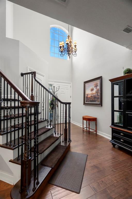 1342 Ribolla Drive Palm Harbor, FL 34683 - Photo 3 of 37 a view of staircase with furniture and wooden floor