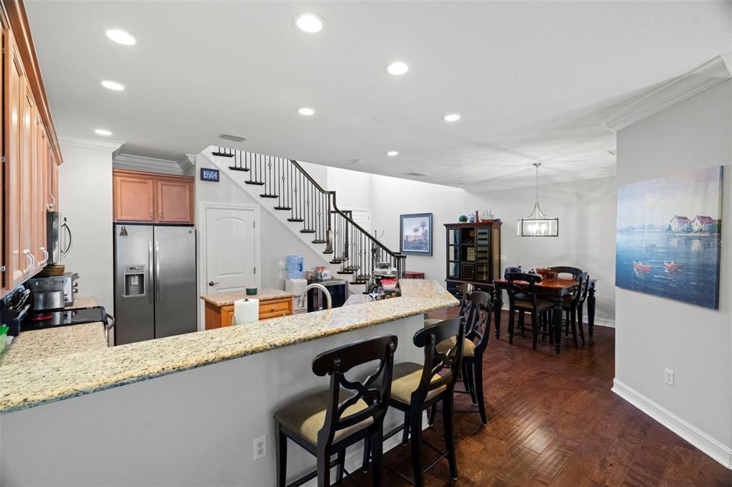 1342 Ribolla Drive Palm Harbor, FL 34683 - Photo 6 of 37 a group of people sitting on a table and chairs in a room