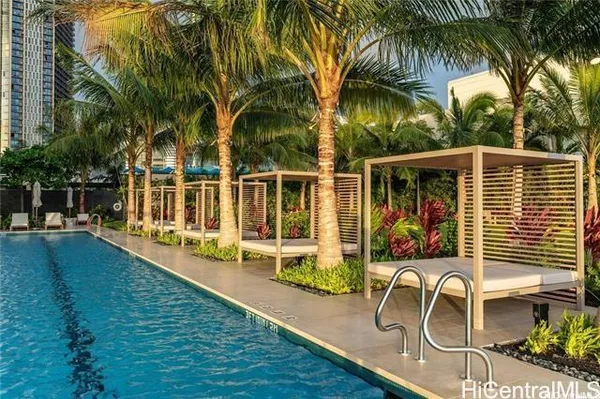 a house view with a seating space and swimming pool