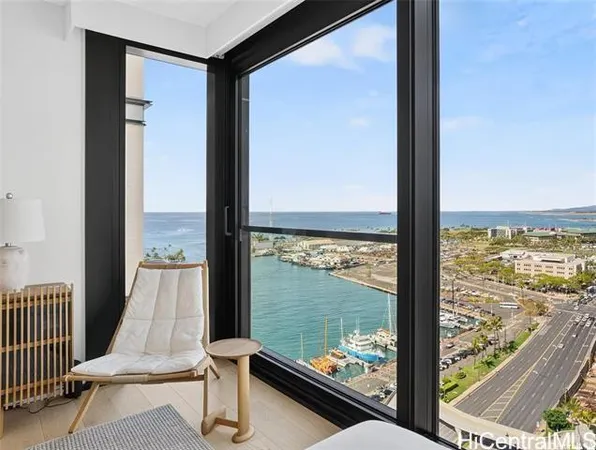 a view of a room with balcony and floor to ceiling window