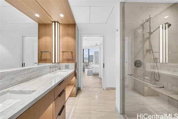 a spacious bathroom with a granite countertop sink mirror and a bath tub