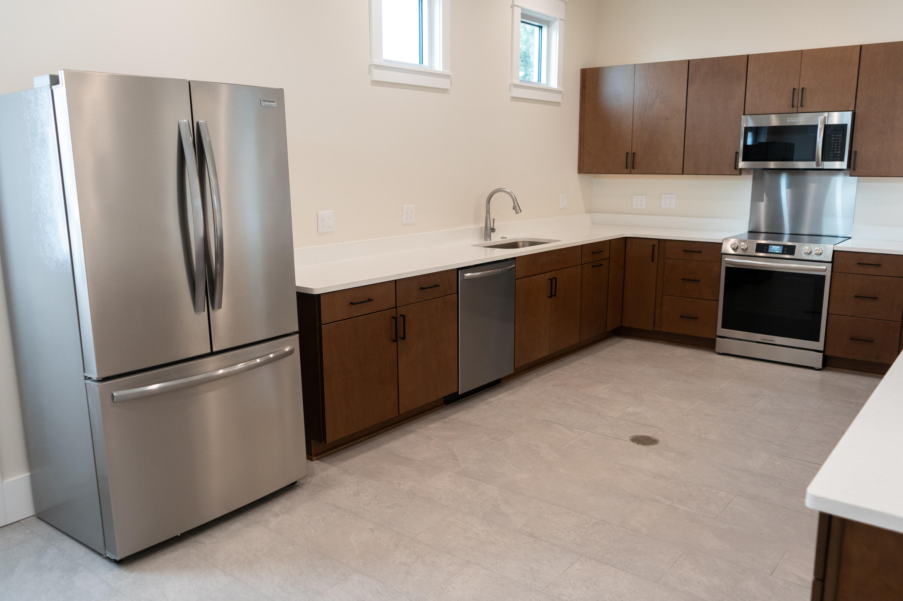 412 Marsh Deer Run Niceville, FL 32578 - Photo 11 of 13 a kitchen with stainless steel appliances a refrigerator and a sink