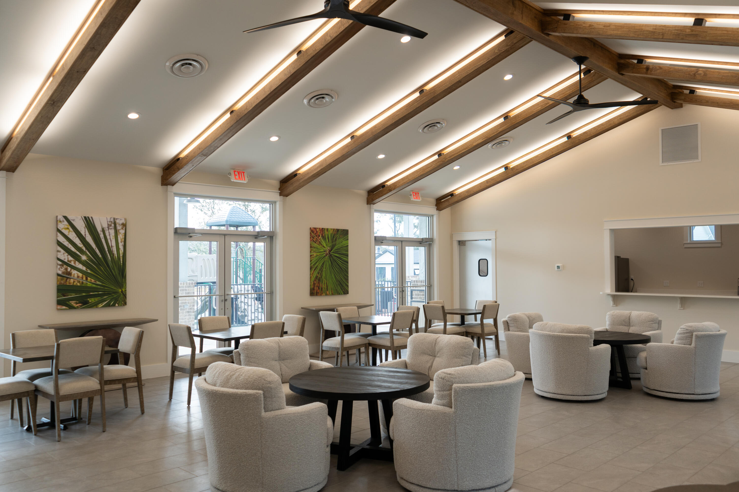 412 Marsh Deer Run Niceville, FL 32578 - Photo 10 of 13 a large room with lots of white furniture and a large window