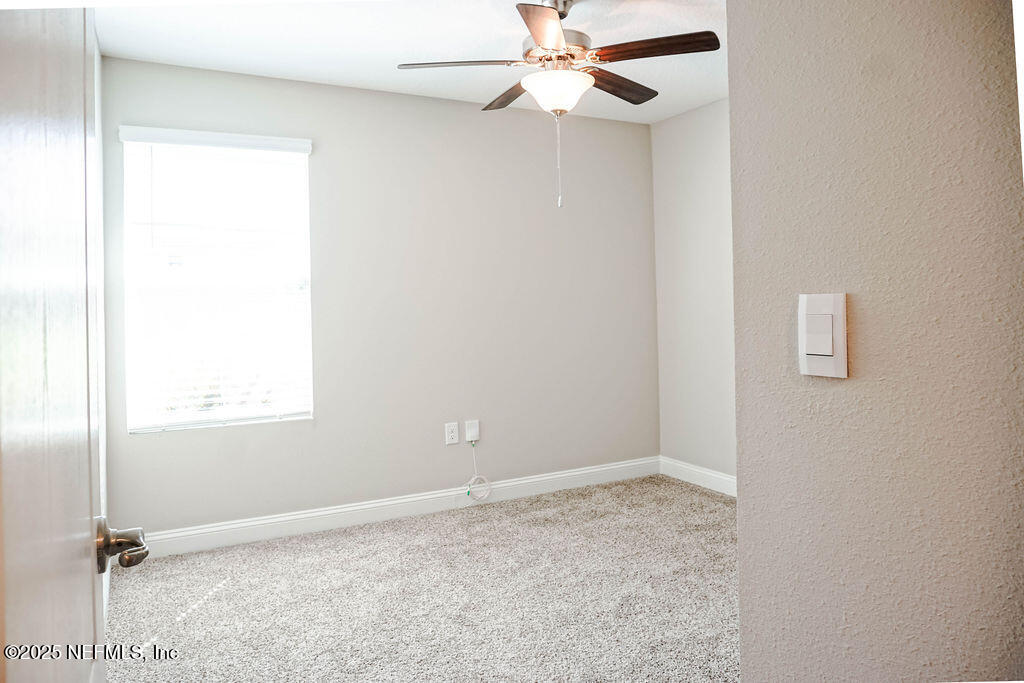 114 Eagles Landing Ln Street St. Augustine, FL 32095 - Photo 15 of 21 an empty room with a window