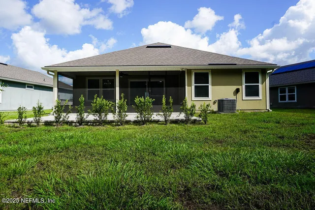a front view of a house with garden and porch