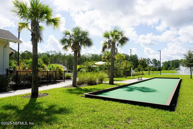 a view of swimming pool with a yard