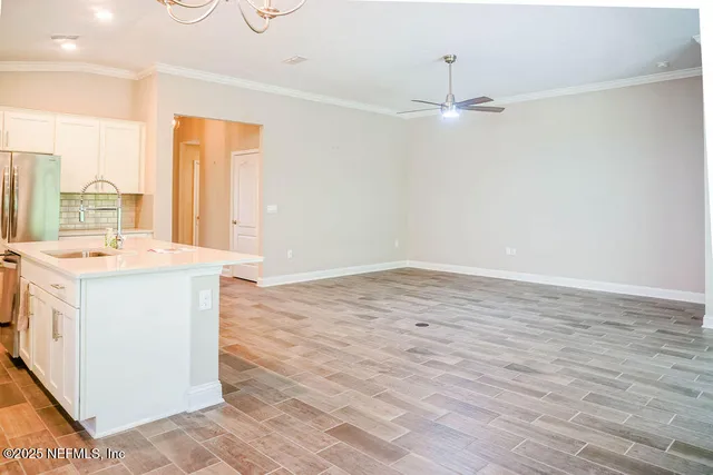 a room with a sink washer and dryer