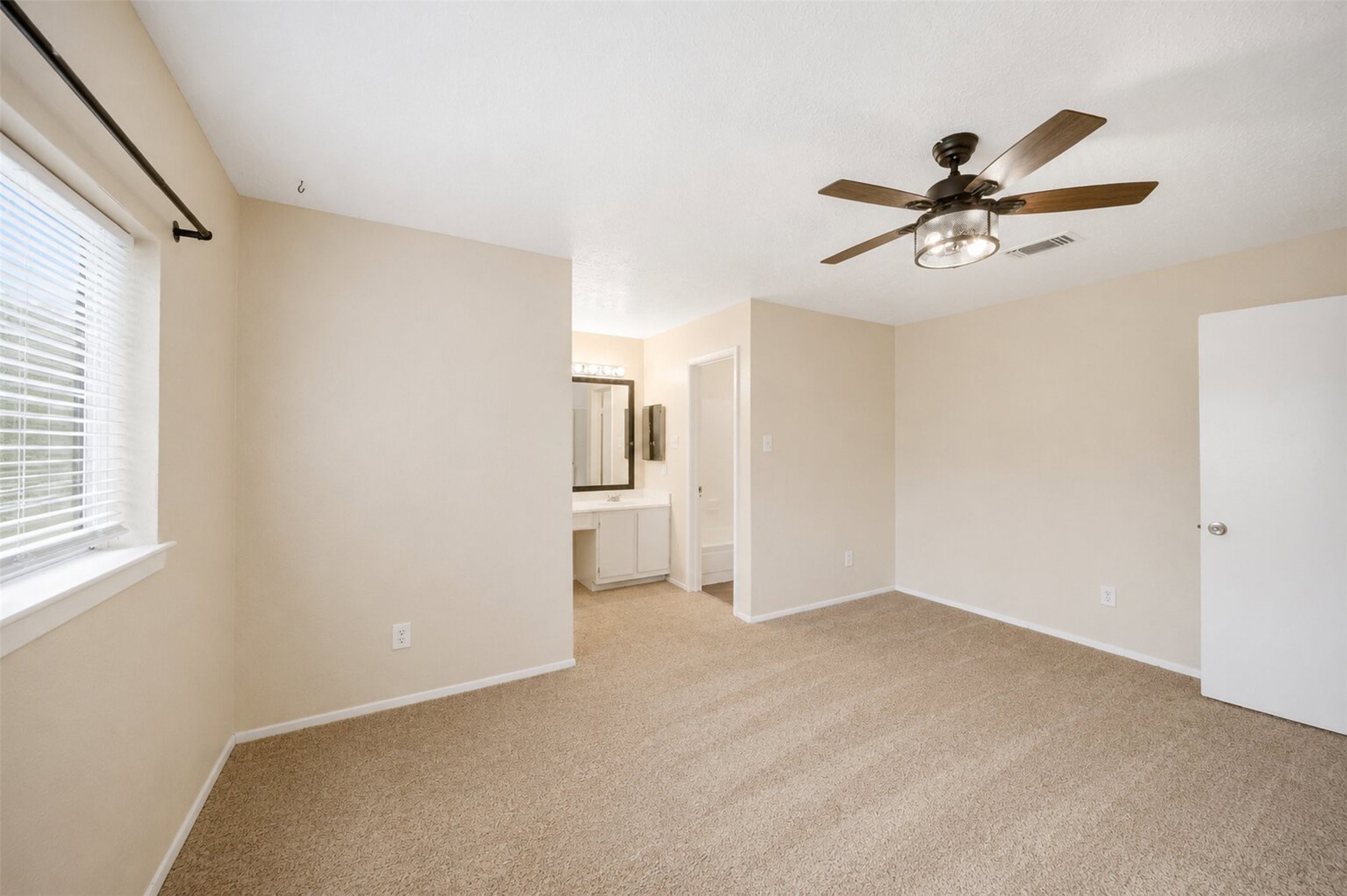 4818 Quailgate Drive Spring, TX 77373 - Photo 20 of 26 a view of a livingroom with a ceiling fan and window
