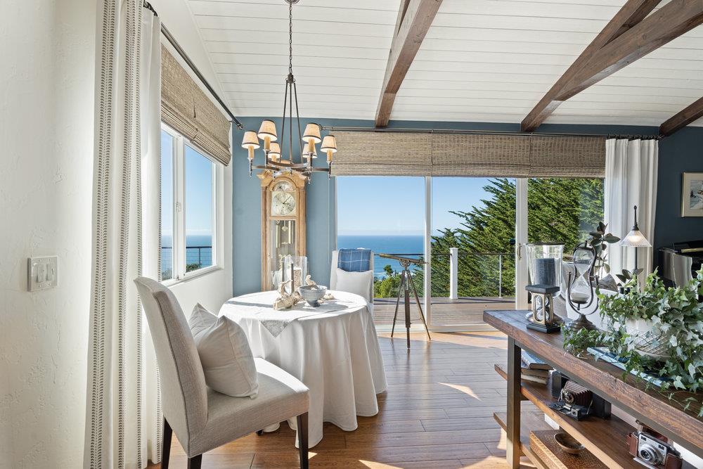 15 Mentone Road Carmel, CA 93923 - Photo 28 of 56 a dining room with furniture a chandelier and wooden floor
