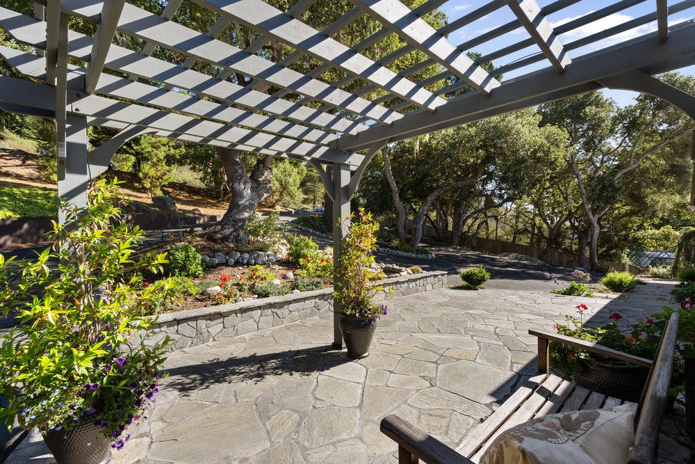 15 Mentone Road Carmel, CA 93923 - Photo 47 of 56 a outdoor space with lots of yellow lighting