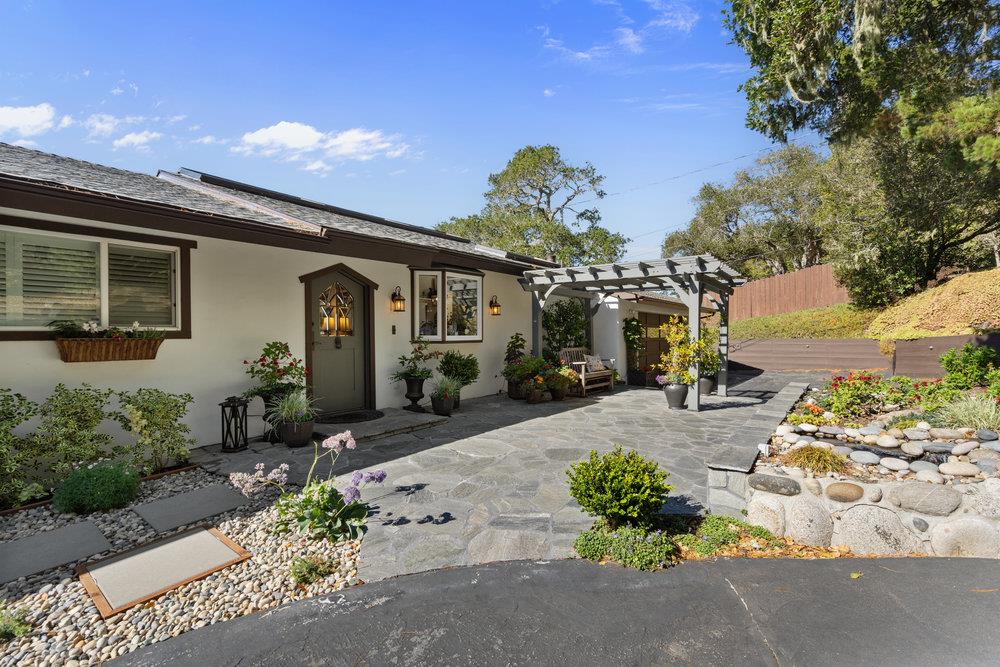 15 Mentone Road Carmel, CA 93923 - Photo 50 of 56 a front view of a house with a yard