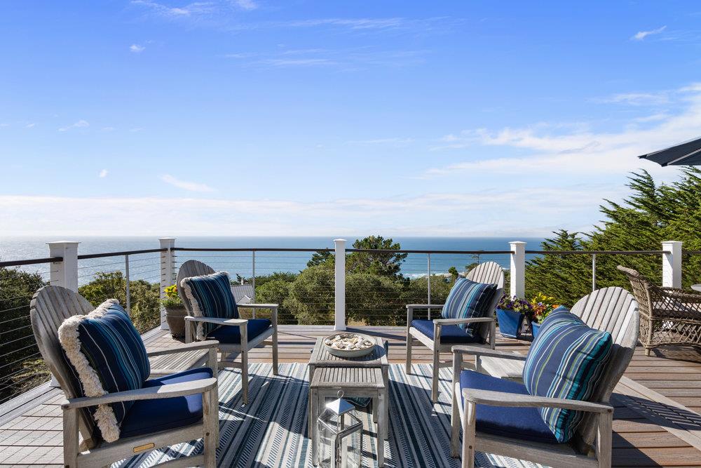 15 Mentone Road Carmel, CA 93923 - Photo 5 of 56 a view of a balcony with chairs and potted plants