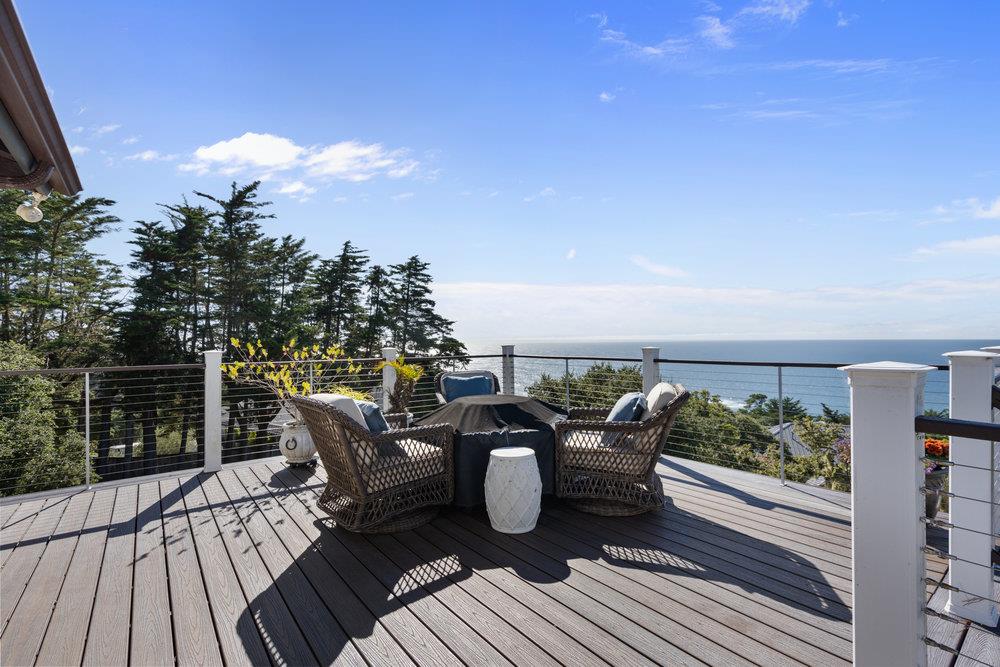 15 Mentone Road Carmel, CA 93923 - Photo 7 of 56 a view of a balcony with furniture and wooden floor