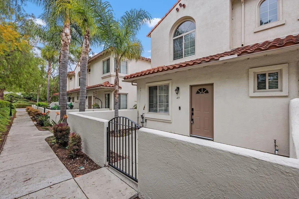 4054 Craven Road, Unit 49 Oceanside, CA 92057 - Photo 1 of 37 a front view of a house with a porch