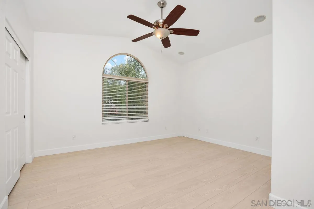 4054 Craven Road, Unit 49 Oceanside, CA 92057 - Photo 18 of 37 an empty room with a window and a fan