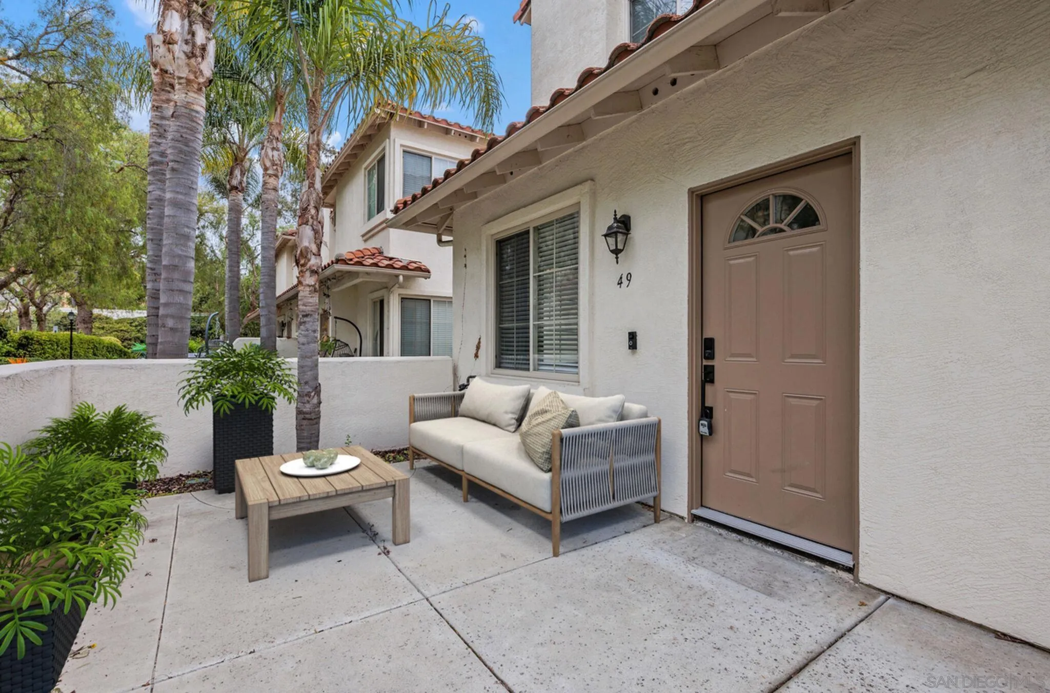 4054 Craven Road, Unit 49 Oceanside, CA 92057 - Photo 2 of 37 a view of a couches in a patio of a house