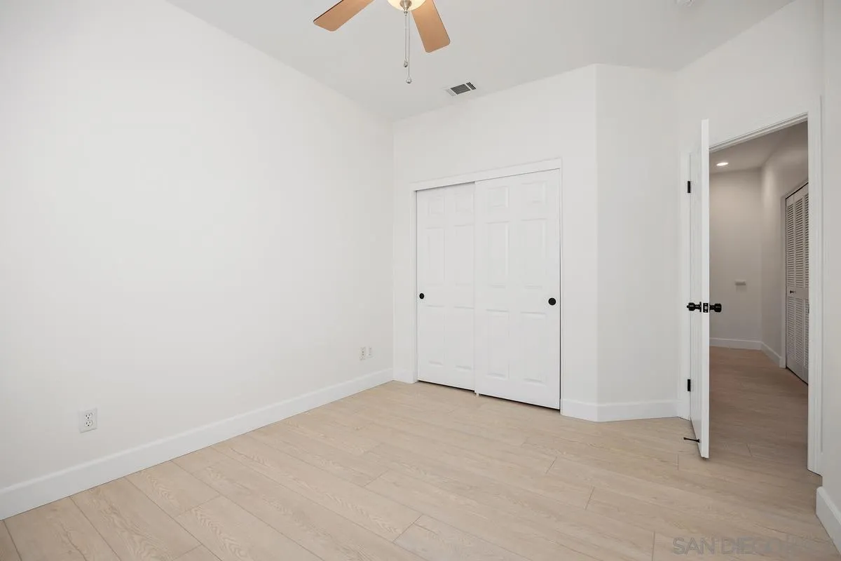 4054 Craven Road, Unit 49 Oceanside, CA 92057 - Photo 28 of 37 an empty room with a ceiling fan and closet area