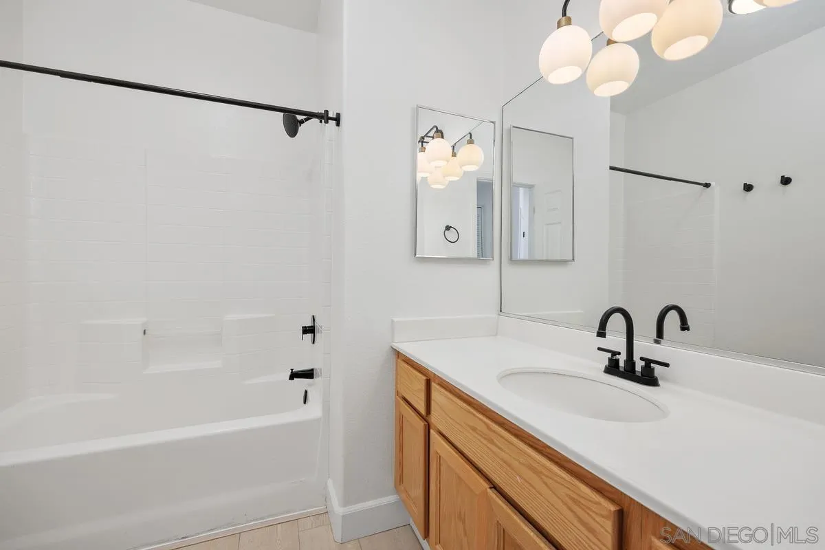 4054 Craven Road, Unit 49 Oceanside, CA 92057 - Photo 29 of 37 a bathroom with a sink and a mirror