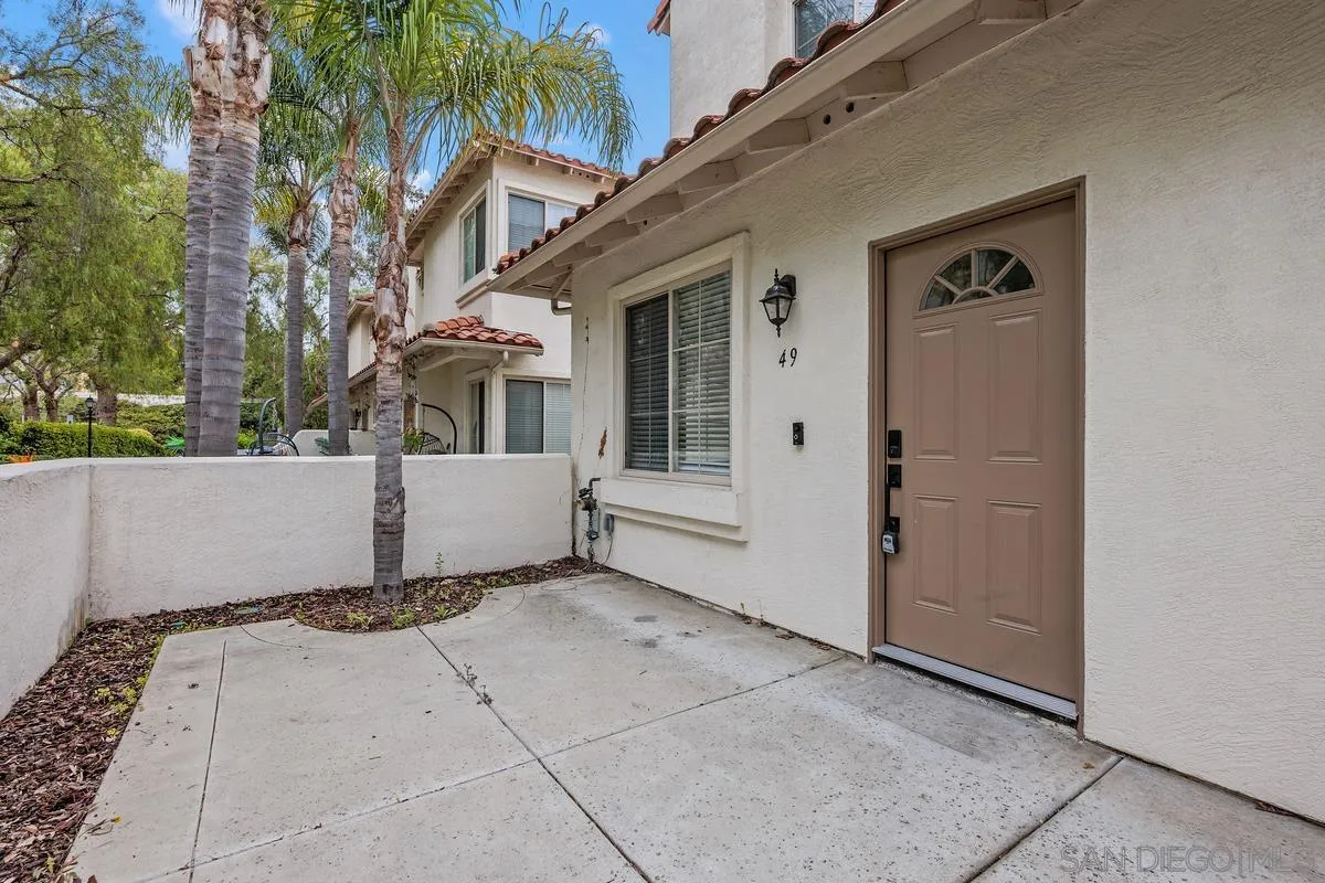 4054 Craven Road, Unit 49 Oceanside, CA 92057 - Photo 3 of 37 a view of a house with a tree