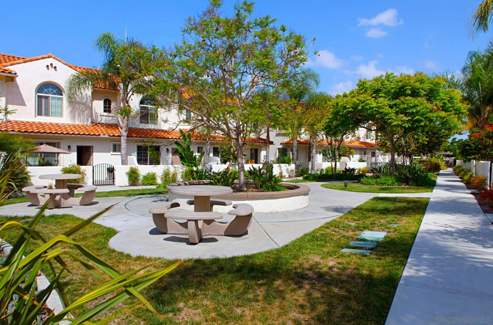 4054 Craven Road, Unit 49 Oceanside, CA 92057 - Photo 36 of 37 a view of a building with garden and tall trees