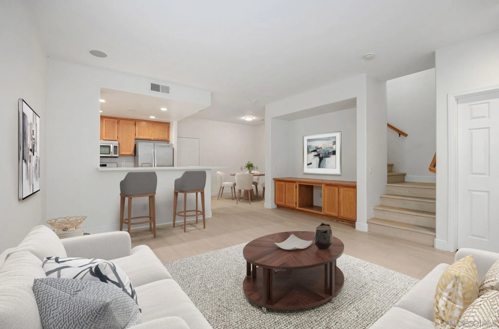 4054 Craven Road, Unit 49 Oceanside, CA 92057 - Photo 6 of 37 a living room with furniture and a wooden floor
