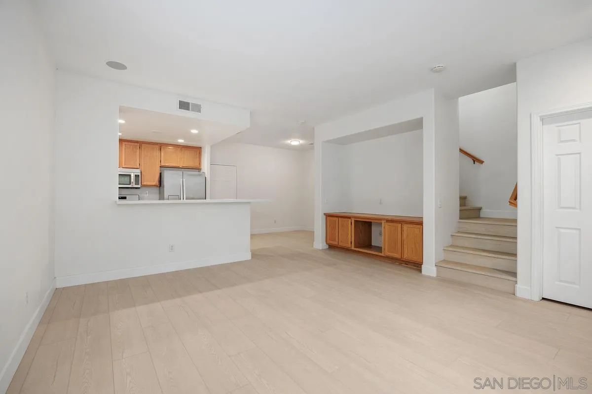 4054 Craven Road, Unit 49 Oceanside, CA 92057 - Photo 7 of 37 an empty room with a cabinet and mirrors