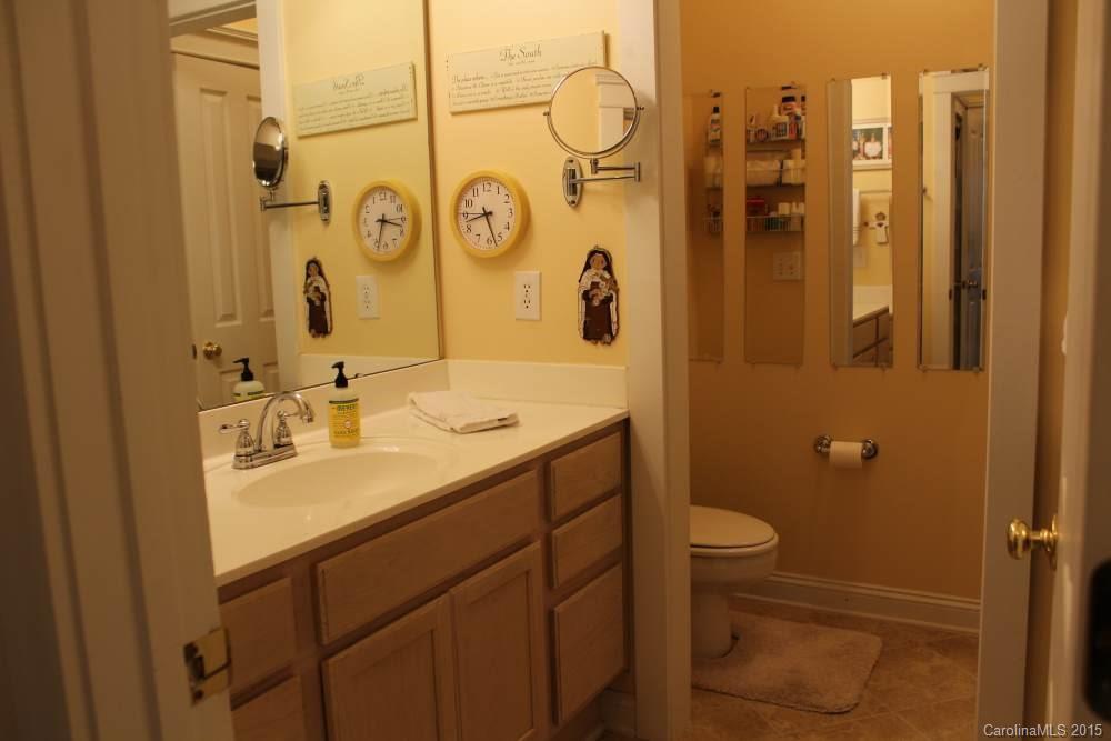 8207 Strandhill Road Huntersville, NC 28078 - Photo 14 of 24 a bathroom with a sink toilet and shower