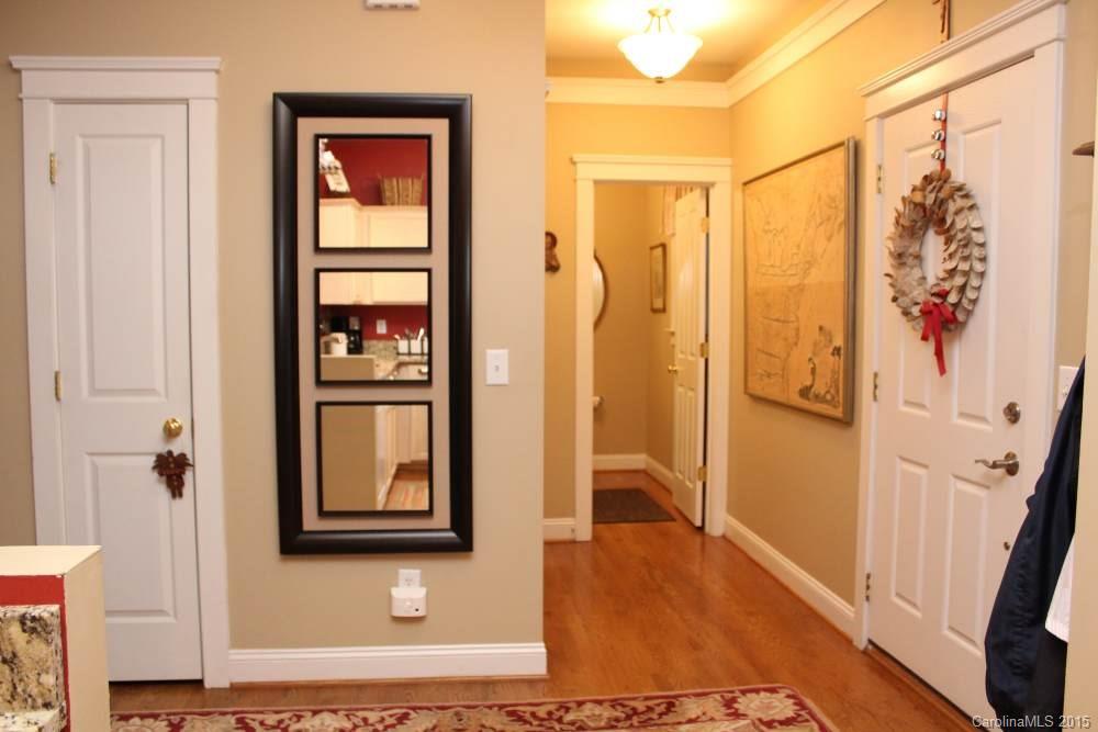 8207 Strandhill Road Huntersville, NC 28078 - Photo 3 of 24 a view of a hallway with wooden floor and door