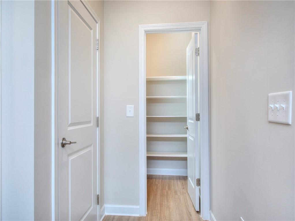2562 Harbor Ridge Pass, Unit 338 Gainesville, GA 30507 - Photo 11 of 21 a view of a closet area with empty racks