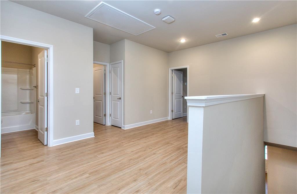 2562 Harbor Ridge Pass, Unit 338 Gainesville, GA 30507 - Photo 15 of 21 a view of empty room with wooden floor