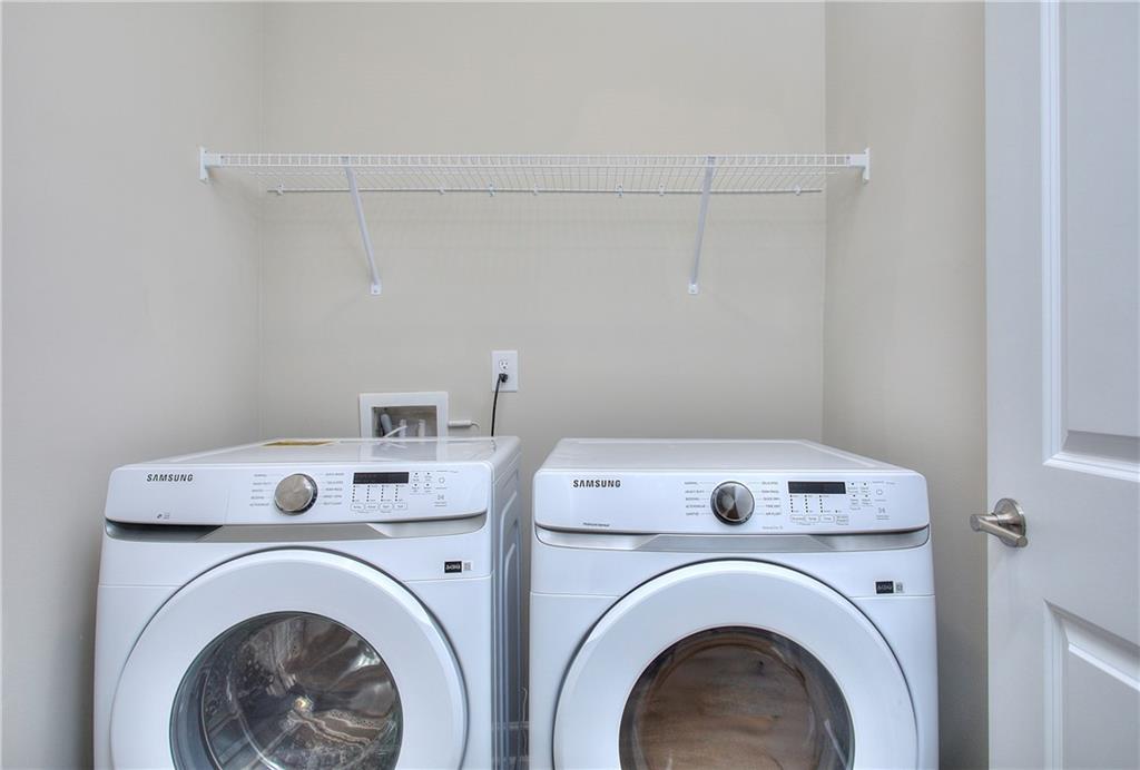 2562 Harbor Ridge Pass, Unit 338 Gainesville, GA 30507 - Photo 21 of 21 a utility room with dryer and washer