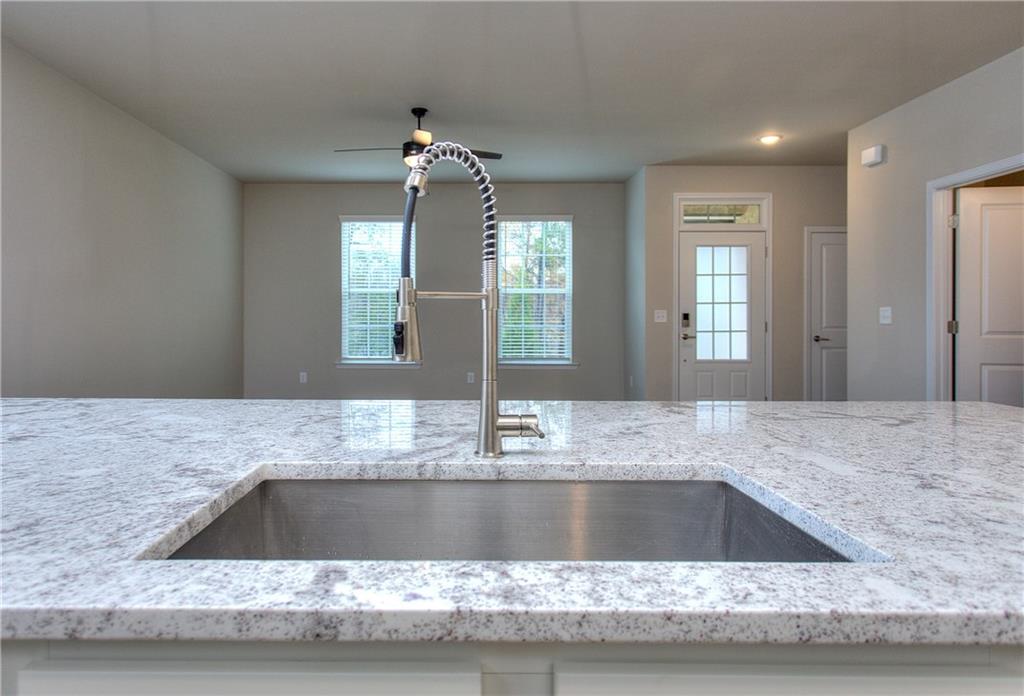 2562 Harbor Ridge Pass, Unit 338 Gainesville, GA 30507 - Photo 7 of 21 a view of a kitchen counter a sink and a mirror