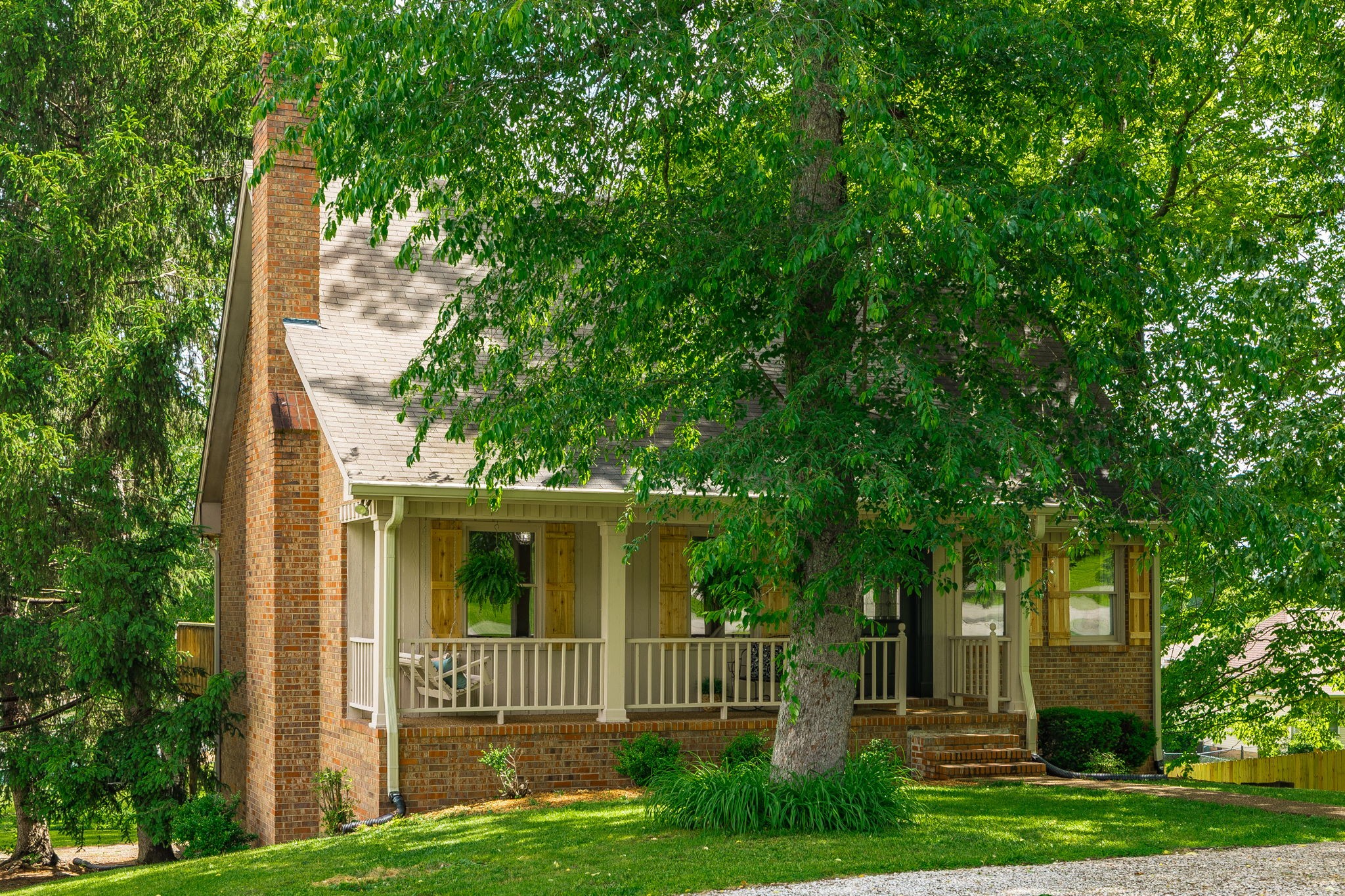 a view of house with a yard