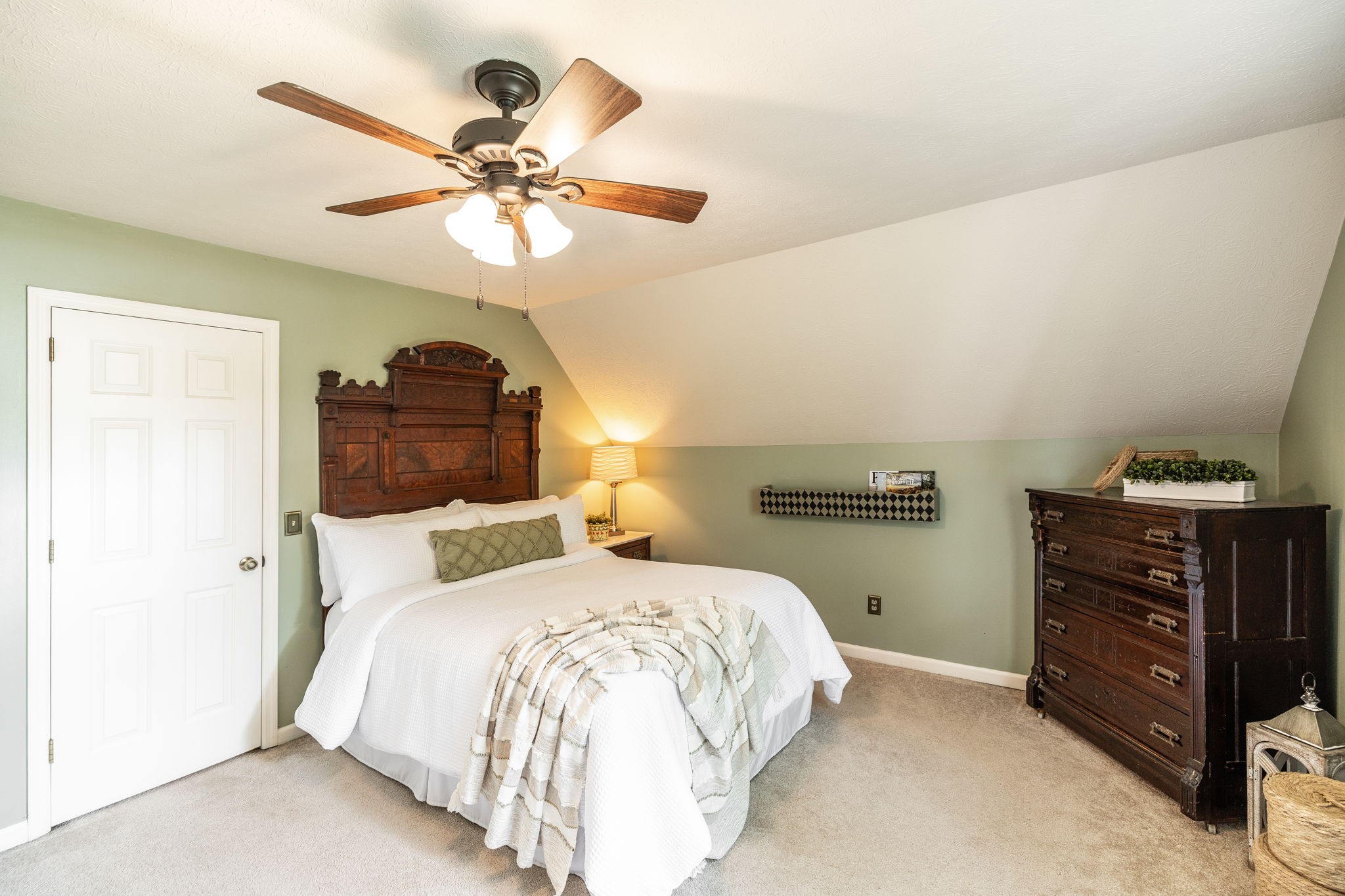 405 Timberlake Drive Springfield, TN 37172 - Photo 40 of 46 a bedroom with a bed and a chandelier