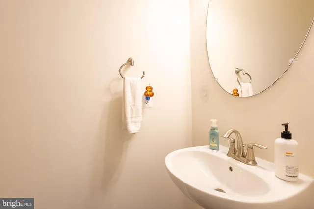 a bathroom with a sink and mirror