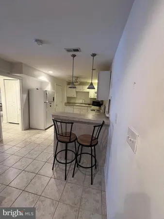 a dining room with a table and chairs