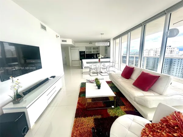 a living room with furniture fireplace and a flat screen tv