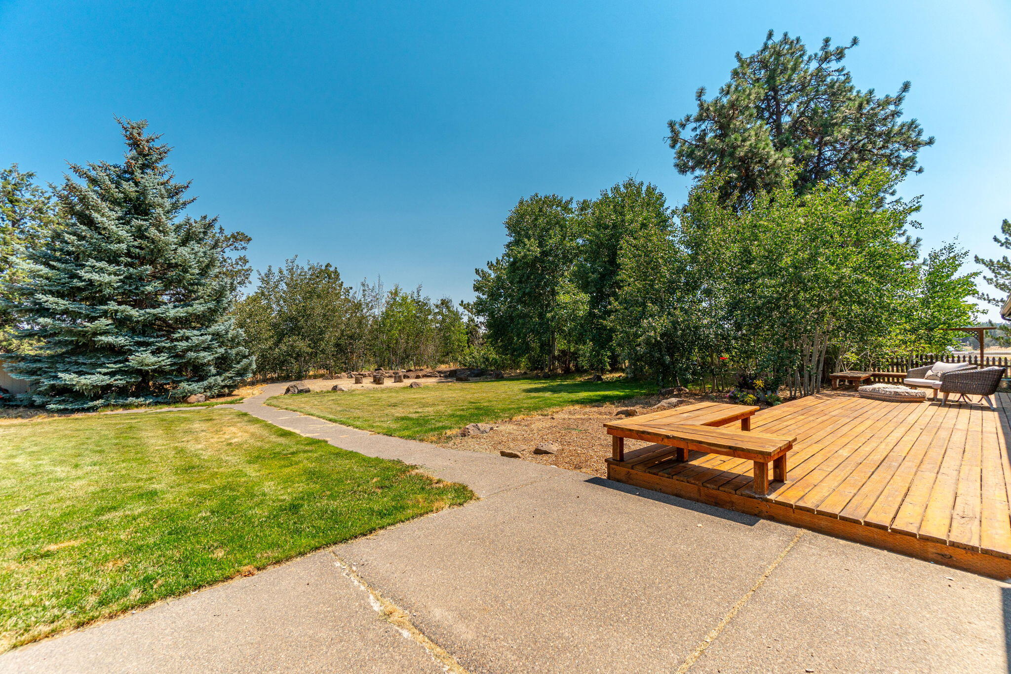 19460 Rudi Road Bend, OR 97703 - Photo 36 of 44 Back deck with yard and fire pit.