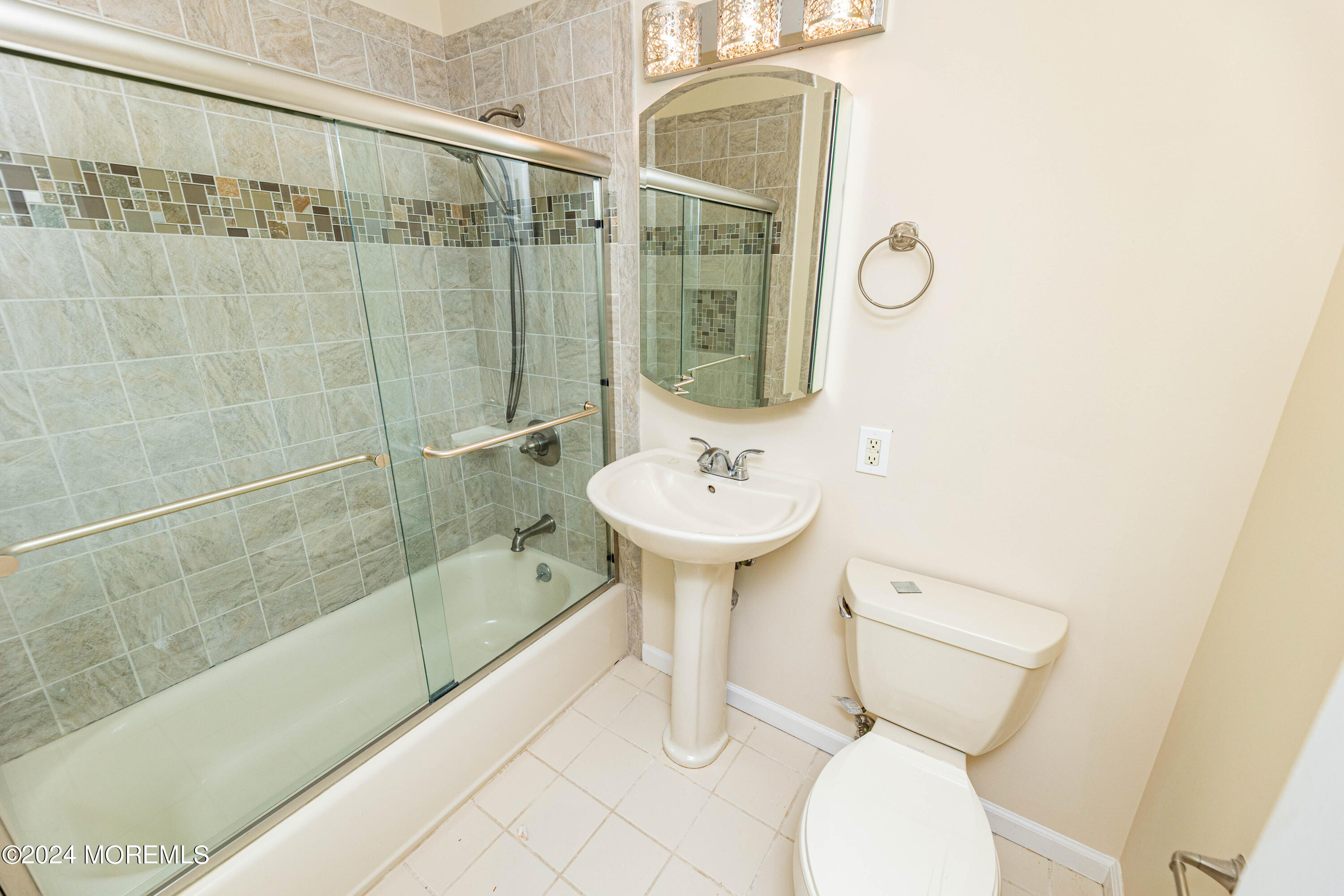 301 Spring Street, Unit 11 Red Bank, NJ 07701 - Photo 16 of 40 a bathroom with a sink toilet and shower