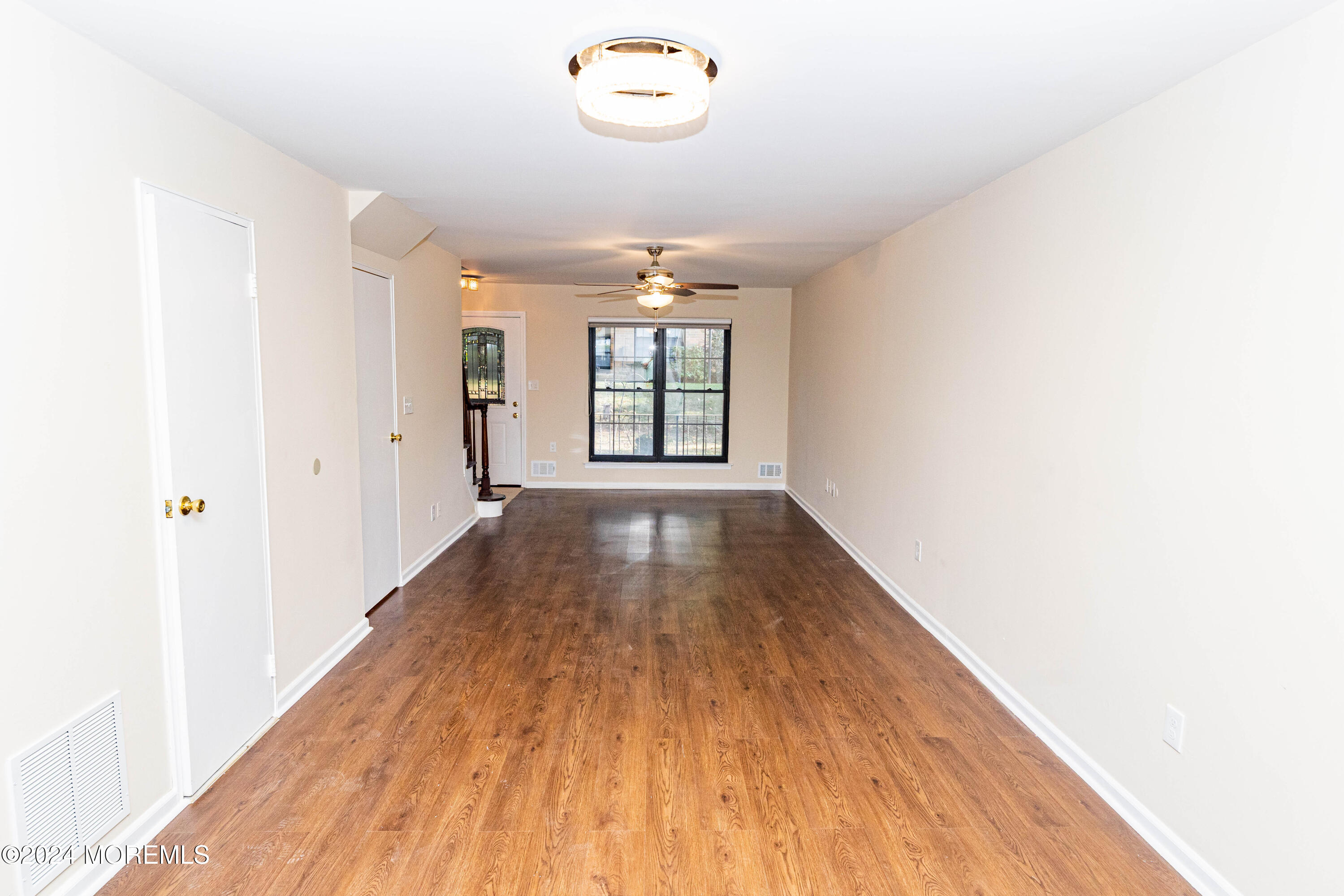 301 Spring Street, Unit 11 Red Bank, NJ 07701 - Photo 17 of 40 a view of a hallway with wooden floor