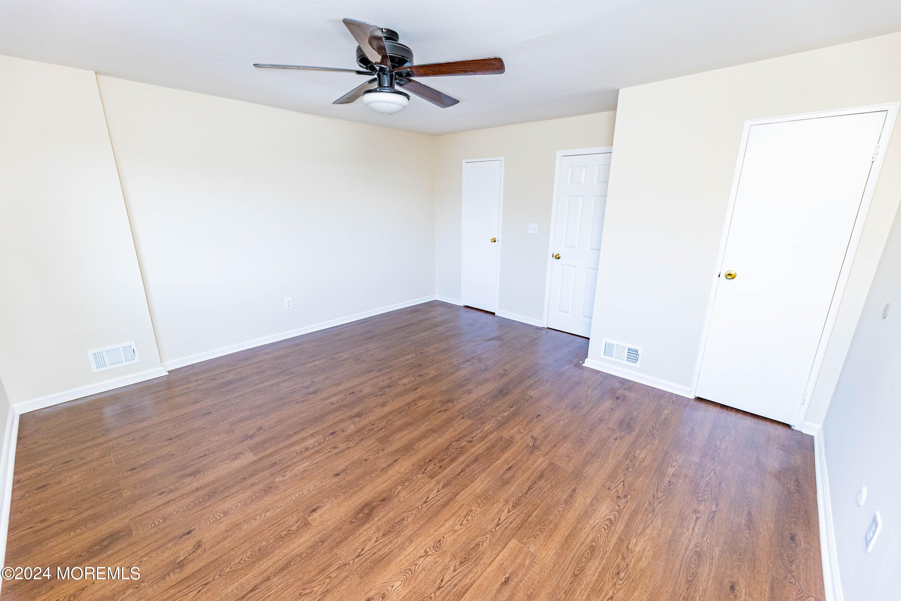 301 Spring Street, Unit 11 Red Bank, NJ 07701 - Photo 18 of 40 a view of empty room with wooden floor