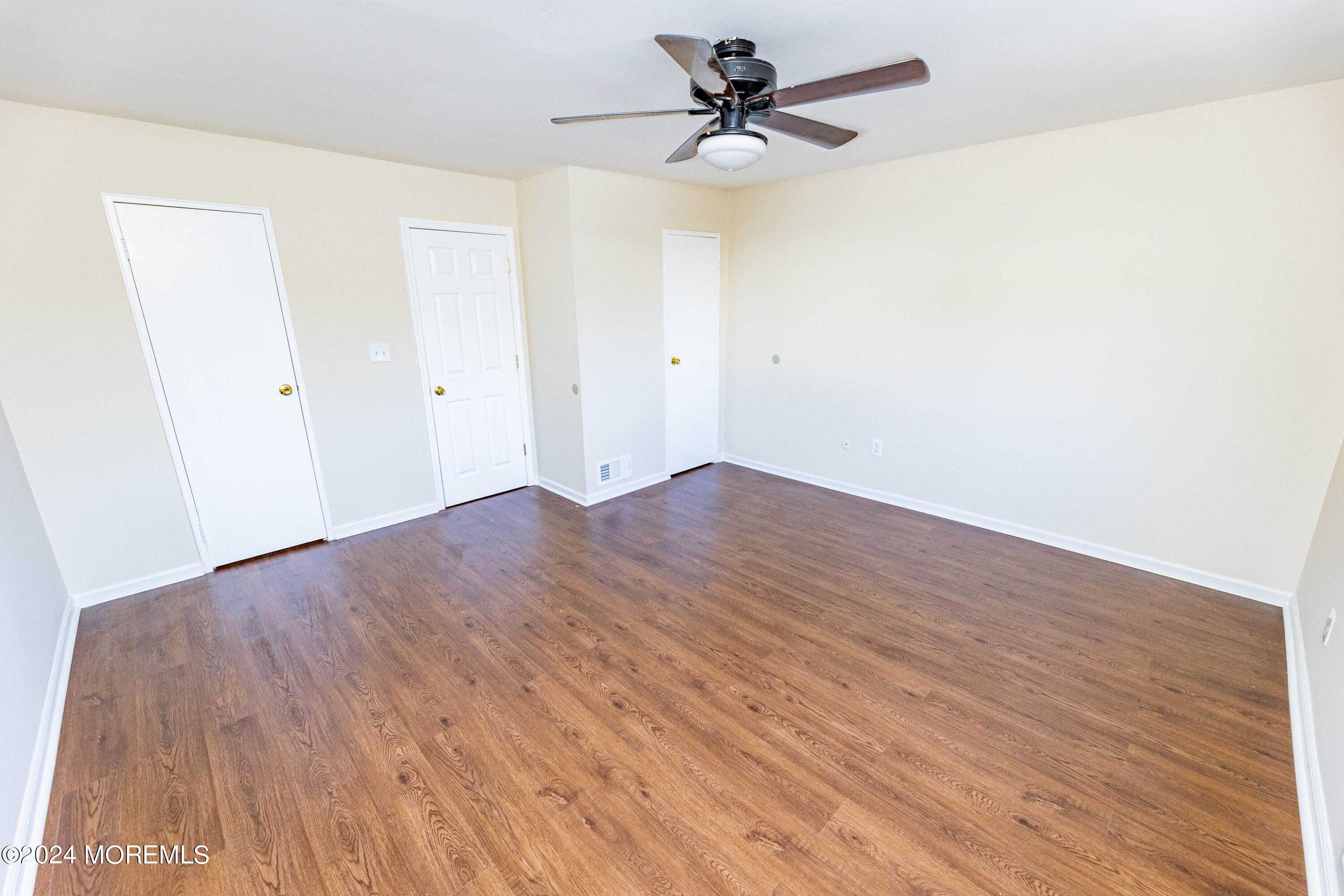 301 Spring Street, Unit 11 Red Bank, NJ 07701 - Photo 19 of 40 a view of empty room with wooden floor